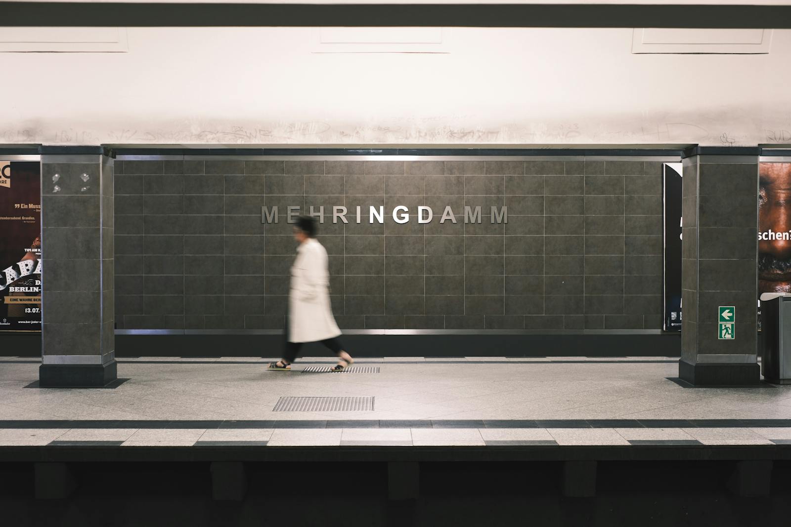 Person Walking at Mehringdamm Station in Berlin